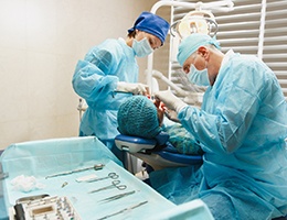 Castle Rock implant dentist and assistant working on a patient