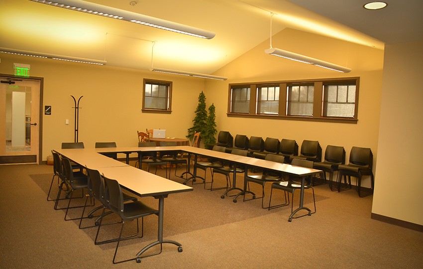 Conference room set up with tables and chairs