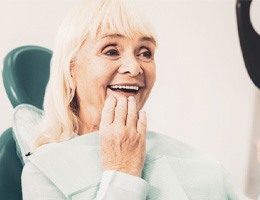 Woman pleased with her complete smile 