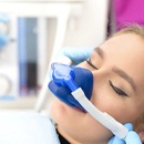 A young female undergoing nitrous oxide sedation before a dental treatment