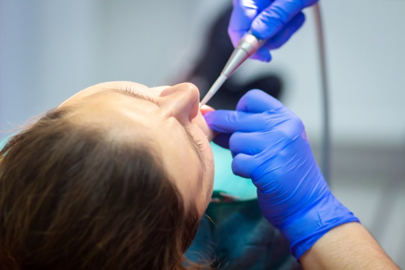 woman receiving sedation dentistry in Castle Rock